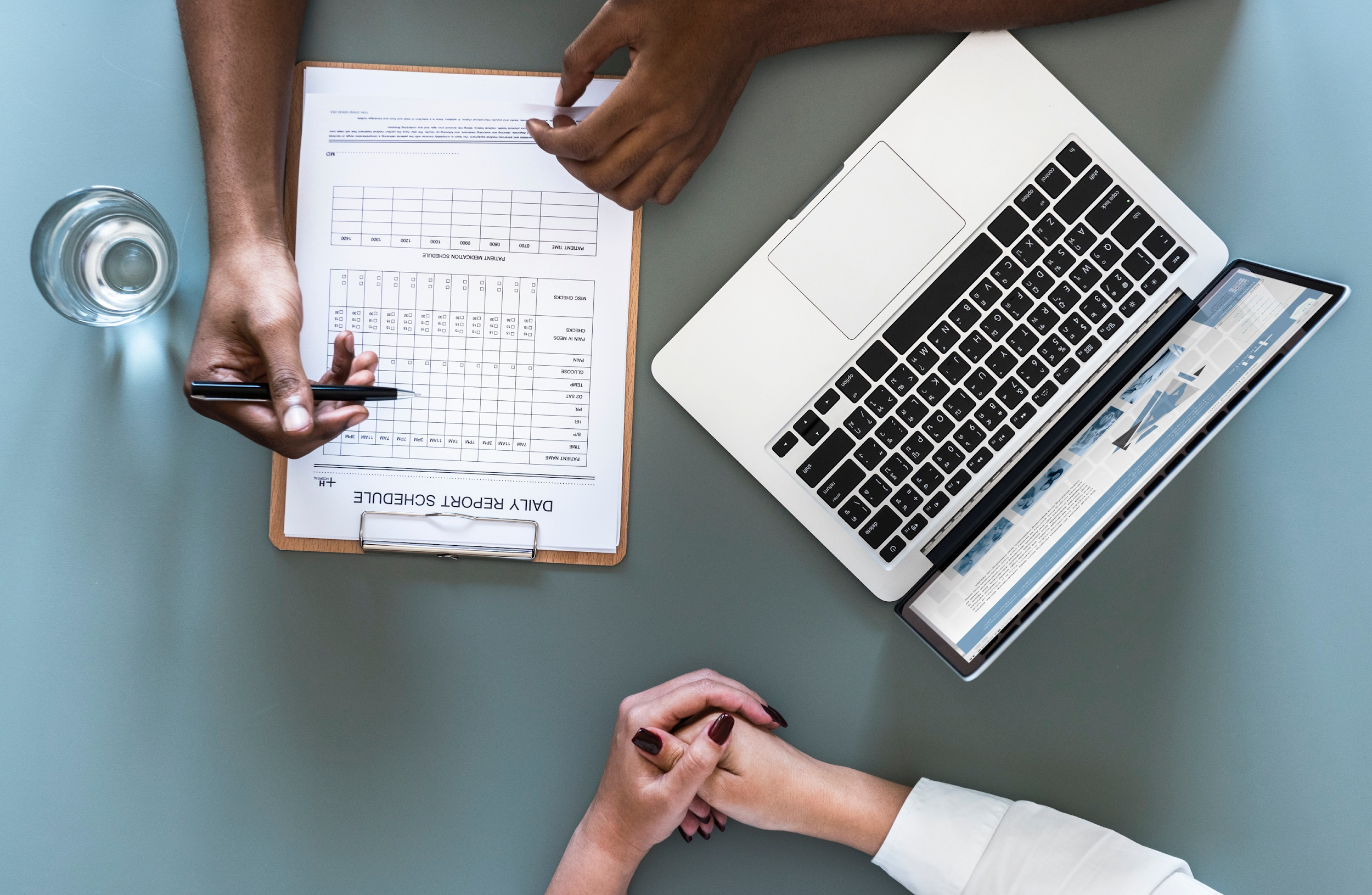 A doctor reviews medical information with a patient.